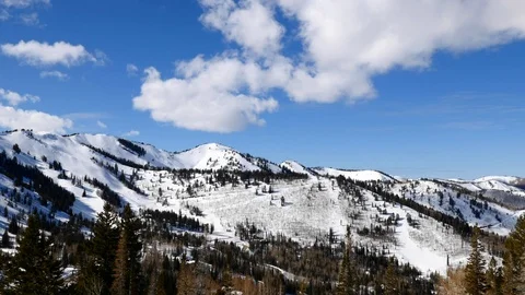 Time-lapse of snow-covered Wasatch Mountains, Canyons Village, Utah. Stock Footage 99924470