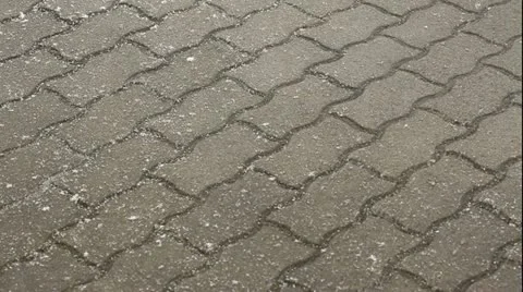 Time-lapse of snow falling on a pavement 1 Stock Footage