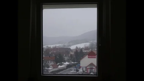 Time Lapse of a Snowy Day Through a House window Stock Footage 86147806