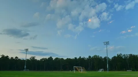 Time Lapse of Soccer Field in evening light with rolling clouds Stock Footage 18121589