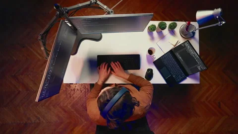 Time lapse of software technician writing code on computer and laptop at home Stock Footage 265515408