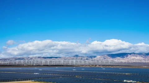 Time Lapse - Solar Panel with Wind Turbine in the Mountain Ranges Stock Footage 52044574