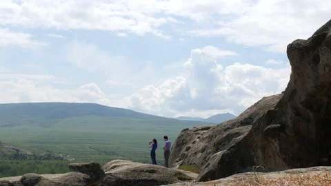 Time lapse with some tourists in Uplistsikhe, an ancient rock-hewn town  Stock Footage 90351259
