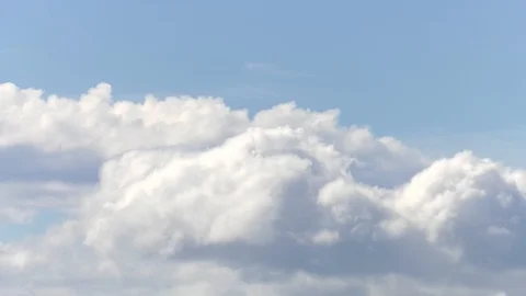 Time Lapse Sped Up White Clouds moving against blue sky Background Footage Video stock 106191421