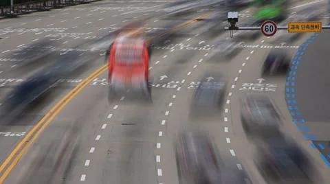 Time lapse of a speed camera against city traffic on road curved Stock Footage 62586302