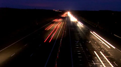 Time lapse of speeding traffic on uk motorway at night Stock Footage 32963207