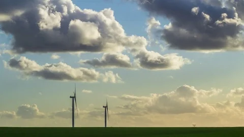 Time lapse of spinning wind turbines for electrical power generation Stock Footage 82432270