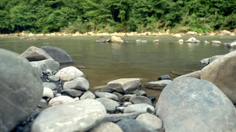 Time lapse. splash of water in a mountain river near the mountain forest. view Stock Footage 111347328