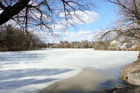 Time Lapse of spring pond with sky blue sky and clouds Stock Photos