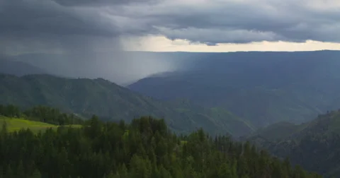 Time-lapse of spring storm swirling over Hells Canyon from Graves Point Stock Footage