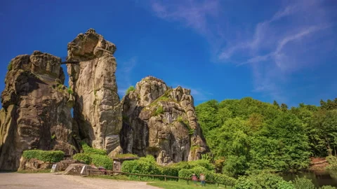 Time Lapse. Springtime paints as the clouds float over a mountainous landscape. Stock Footage 155708485