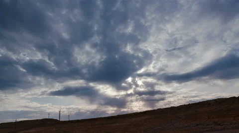 Time lapse. Сracked soil. Sun rays throgh the sky Stock Footage 63763710