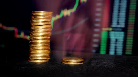 Time Lapse of Stack Bitcoin Coins Falling Against Background of Cryptocurrency Stock Footage 260471009