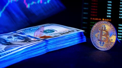 Time Lapse of Stack of Dollar Falling Against Background of Cryptocurrency Chart Stock Footage 263443173