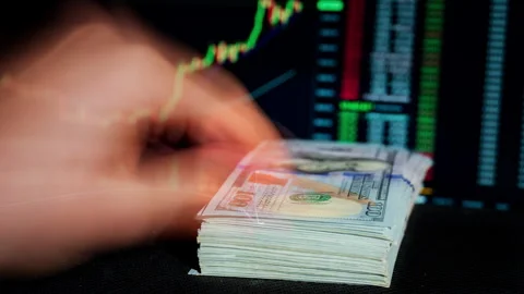 Time Lapse of Stack of Dollar Growing Against Background of Cryptocurrency Chart Stock Footage 260470709