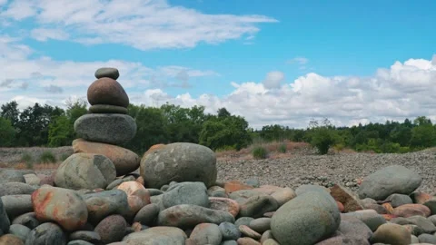 Time lapse of a stacked stone cairn on an American River Parkway tailing pile Stock Footage 335852487
