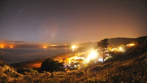Time lapse of star trails and moonrise over Jalama Beach campground in Santa Stock Footage 107557997