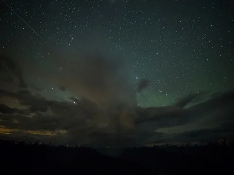 Time lapse starry night sky covered by clouds Stock Footage 84561731