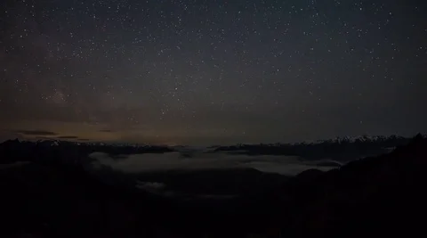 Time lapse of starry night sky covered by clouds Video stock 84563819