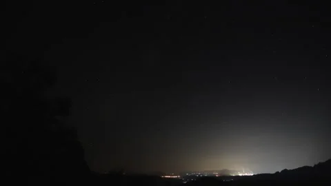 Time-lapse of a starry night sky, and an airplane flying through a starry n.. Stock Footage 319838775