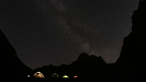 Time lapse of starry sky in the mountains. Camp climbers under the starry sky. Stock Footage 97246649