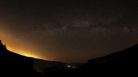 Time lapse of stars behind mountain  Stock Footage 24978859