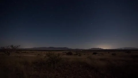 Time lapse of stars over a high desert prairie in the moonlight Stock Footage 284486642
