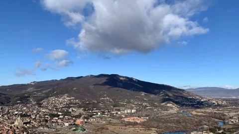 Time lapse of a stationary cumulus cloud over mountain top Stock Footage 124072414