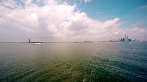 Time Lapse Statue of Liberty Long Shot on Hudson River 4K Stock Footage 50145698