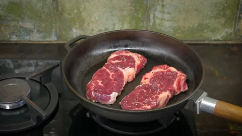 Time lapse of steak cooking on the iron pan. UHD, 4K Stock Footage 104859838