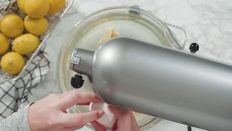 Time lapse. Step by step. Flat lay. Mixing ingredients into the batter for lemon Stock Footage 227941324