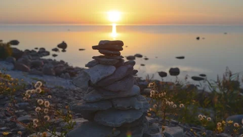 Time lapse of a stone tower at the sea with sunset. Sun goes down 4K Stock Footage 282354511