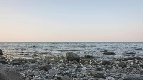 Time lapse of a stony beach with lying dry tree Stock Footage 95913878