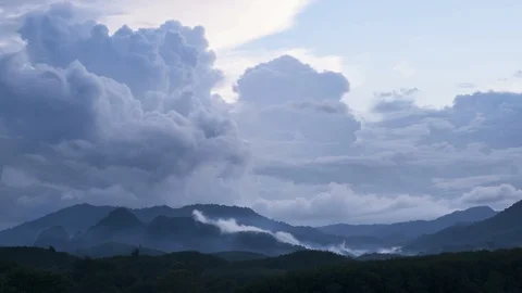 Time lapse storm cloud coming to mountain range in tropical rainforest Видео 93109055