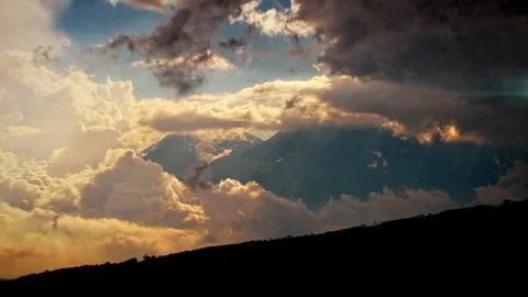 Time lapse of storm clouds around volcanoes 스톡 동영상 250486746