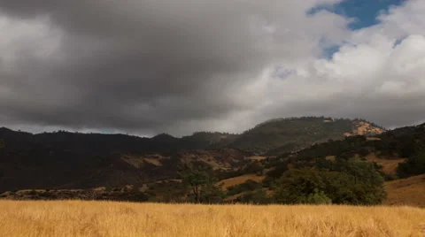 Time lapse storm clouds billow over hills and meadows - Time Lapse 2018 HD, 4K Stock Footage 58066787