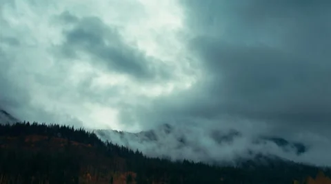 Time lapse storm clouds billow over forested hills - Time Lapse 2047 HD, 4K Stock Footage 58094387