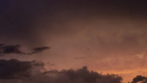 Time lapse of storm clouds building with dramatic sunset colors Stock Footage 246968537