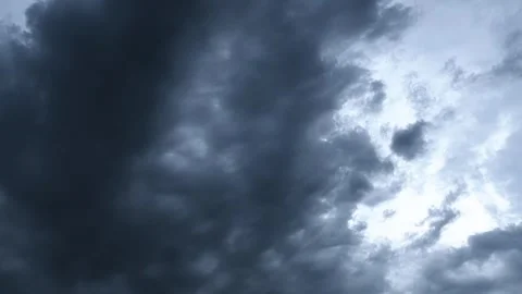 Time-lapse of storm clouds drifting across an evening sky at blue hour Stock Footage 340240197