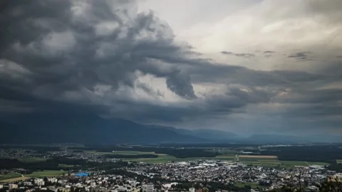 Time lapse of storm clouds forming above small town Kranj in Slovenia Stock Footage 134075674