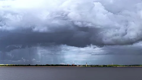 Time lapse of storm clouds gathering over town, dumping sheets of rain Stock Footage 172568248
