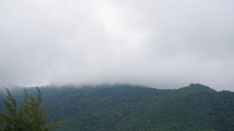 Time lapse of storm clouds growing over mountains Stock Footage 77846059