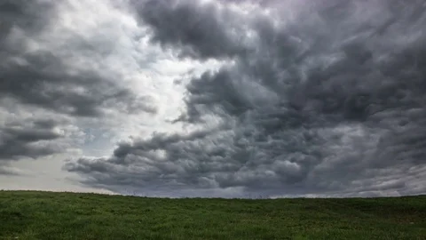 Time lapse storm clouds moving over the field Stock Footage 74344962