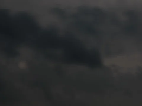 Time lapse of storm clouds moving fast and getting darker : 4K Stock Footage 77388891