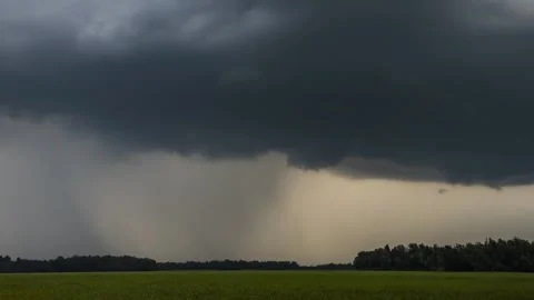 Time lapse of storm clouds moving over farmland grassland farming meadow field Stock Footage 136406815