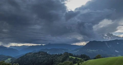 Time lapse storm clouds moving over beautiful countryside covered with trees Stock Footage 137449565