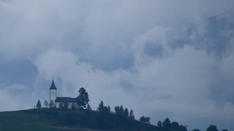Time lapse storm clouds moving over Jamnik church, Slovenia Stock Footage 137450611