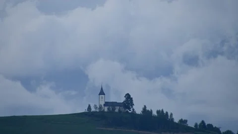 Time lapse storm clouds moving over Jamnik church, Slovenia Stock Footage 137450689