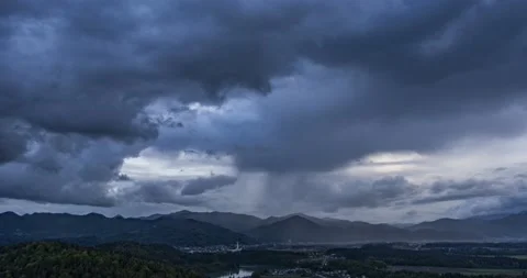 Time lapse of storm clouds moving over hills in Slovenia Video stock 154195102