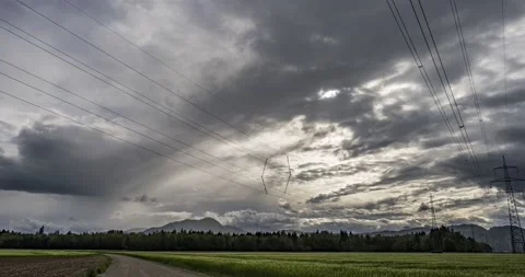 Time lapse of storm clouds moving over farming field Stock Footage 154195201